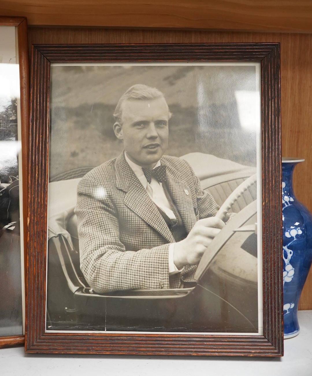 Mike Hawthorn, Challenge me the Race, signed third edition hardback book, together with a framed photograph of Mike Hawthorn, and a press photo of Mike Hawthorn and Stirling Moss (3) Condition - fair